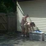 we love to fuck outdoors, a quickie behind the privacy of a fence, but there was a lot of people activity on the other side of the fence.