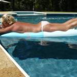 sexy getting some sun in the pool..... let her know what you think!