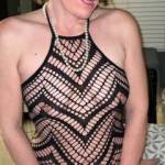 Masked Betty trying on a hot black body suit