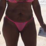 Sheer pink bikinis on the beach.