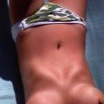 Getting some sun on her perfect titties