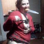 Spanking herself with a meat tenderizer