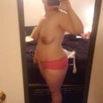 Her posing topless