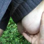 On a small wooden bridge over a stream, my friend has her big tits out - and does not lean forward to hold the top bar, she goes lower to the one below ...