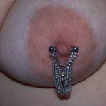 Close-Up of Wifey's right breast with her Dangling Chain nipple ring. We really had fun playing with these last night!