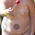 Playing outdoor games at nudist camp