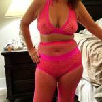 How does my mature wife look in hot pink fishnet?