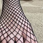 My feet wrapped in fishnet