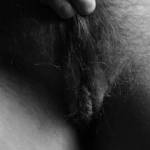 Pulling my bush back to show the photographer my pussy.