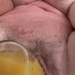 Sweet nectar of orange juice mixing with pussy juice for a special cock-tail