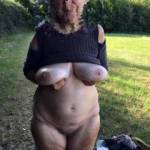 Keeping out of the sunlight for now, to see the baby oil on her big tits better