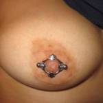 My lover's fat pierced nipple.