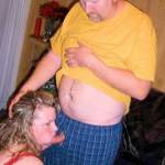 My wife on her knees taking her lovers thick cock into her mouth.