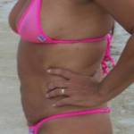 Sheer pink bikinis on the beach.