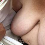 1 of 2 - she holds her shirt open. He wants to see a right nipple