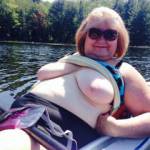 Flashing my big tits on a lake in my boat. Do you want to go boating on the lake