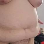 Putting lotion on her naked body