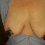 Her new nipple clamps.