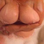 Bathing the girls so they are clean and suckable.