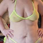 wife trying on her new yellow sheer bathing suit