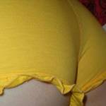 My ass in a pair of yellow boyshort panties.