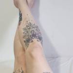 Freshly painted toes and all my leg tats.