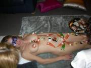 Hi, this pic was taken at a small agathering we held in sydney. I was the sushi platter for 5 other girls. They had to eat the food off my body without using hands or fingers, so you can imagine it was a lot of fun and yes we got about 300 images of the n