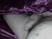 Me laying in a bed, randy & wanting a wet pussy to sink my cock into! Do you think purple satin suits me?