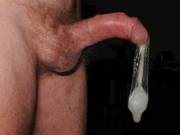 He's such a naughty boy when I'm not around!! Here he is filling a condom with a second load of his yummy cum! Good thing he keeps it for me! :)