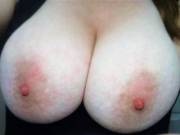 My big tits sometimes want out of my nightie during the evening, so I pull them out like this.  Then, when I awake with my big, fat tits above the covers, my nipples are always hard.  Do you like seeing my big, natural, 40DDD tits? ;)