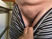 The hairy maid has worked up a sweat, and took her top off - now she asks her underwear be held so she can step out of it in the kitchen