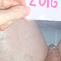 An above view of my small dick with bits of lube scattered upon it as I sit at my desk/PC. A TG1 camera was used.