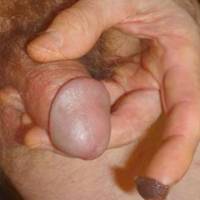 Close up of my fingers holding/grasping my dick as I am about to apply tong balm[brown stuff on my finger] to my dick a 2ND time... December 2024. A T3 camera by Panasonic was used.