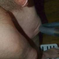 A partial body frontal side view of my dick and hair as I stand on a small step stool in late April 2025. FZ150 camera was used.