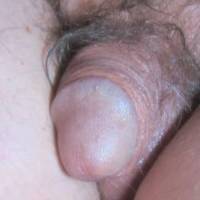A frontal close up of my wrinkled smaller dick as I sit at my desk/PC...  late April of 2024. Canon S95 camera was used.
