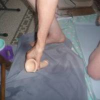 One knee on my floor with a hard dick as I attempt to use my toy to recycle the lube puddle near my bar stool...early May 2025... Z50 camera was used.