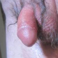 A close up from below of my lubed dick, hair and skin some time after some toy play... late April of 2025... Camera used S95.