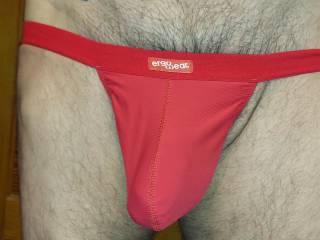 modeling ERGOWEAR RED POUCH THONG