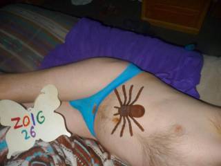 A left side partial body view of me wearing my undie on my bed. Panasonic Z50 camera was used.
