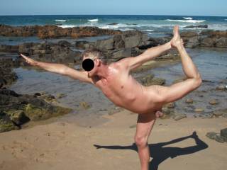 Practicing yoga at a local nude beach
