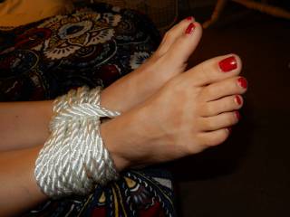 Love those naughty red toes...maybe I will tie them up!