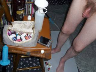 My feet, legs & dick as I stand near a bar stool, where I am mixing the essential oils & massage lotion...September 2023... Camera used, Z50.