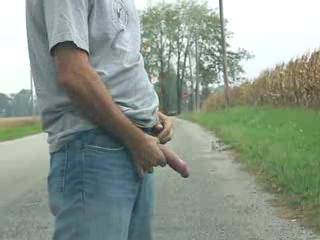 Jerking my cock and cumming outside on a country road.
