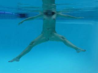 Underwater body shot in the swimming pool at home.