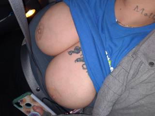 This sexy wife resting in the car with her big tits out