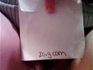 Slut Ann showing the "Zoig" sign.