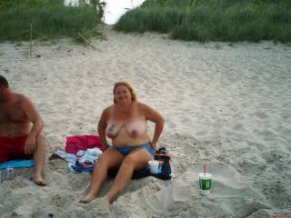 deb siteing at the beach looking for a fisher man