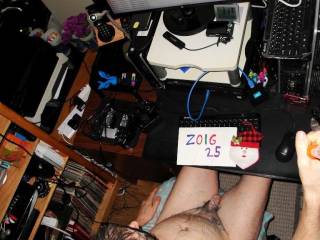 An above selfie view of my body as I sit at my desk/PC... even from a selfie distance, you can see the green lube upon my parts & skin after several hours since I last toy played. A W290 camera was used.