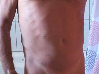 Full frontal in front of the mirror.