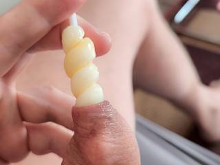 Playing with a lollipop under my foreskin.